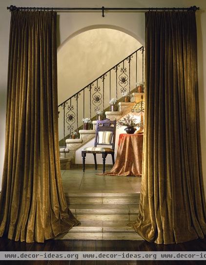 mediterranean staircase by Tommy Chambers Interiors, Inc.