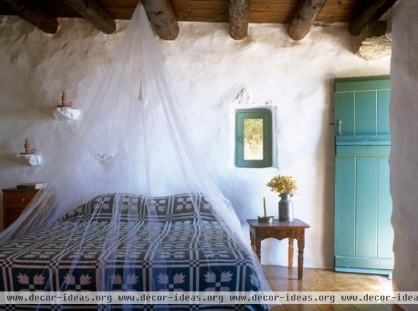 mediterranean bedroom by Deborah French Designs
