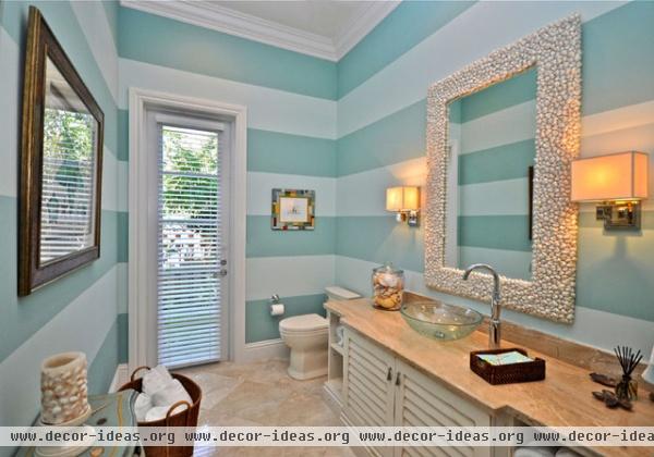 tropical bathroom by Lighthouse Interiors