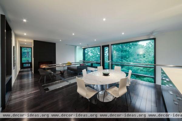 modern dining room by Kariouk Associates