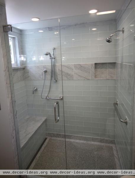 Carrera Marble combined with White Glass creates a transitional bath - traditional - bathroom - hawaii