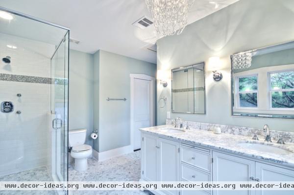 Spa-like master bath with glass chandelier and pedestal tub - traditional - bathroom - austin