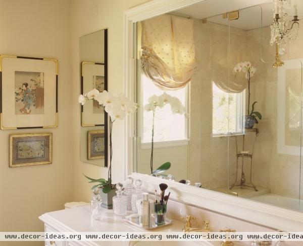 Master bath with Crema Marfil marble and mirrored silk window treatment - traditional - bathroom - los angeles