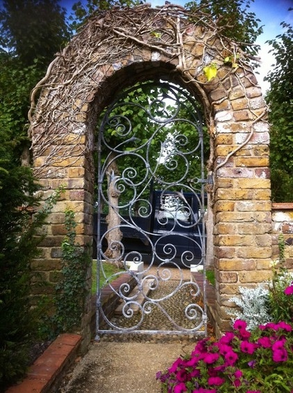 Traditional Exterior by Adrian Payne sculpture and Ironwork